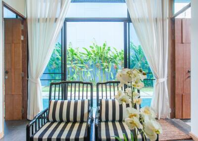 Living room with black and white furniture and large window view