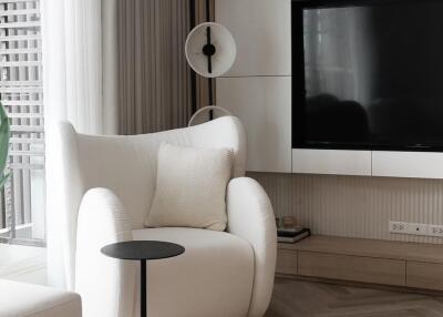 Modern living room with armchair and TV