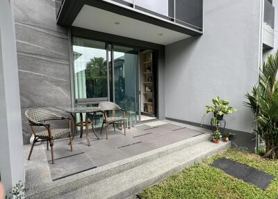 Patio with glass door entry and outdoor seating