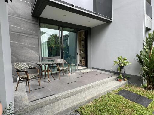 Patio with glass door entry and outdoor seating