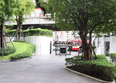 Outdoor area with greenery and modern structures