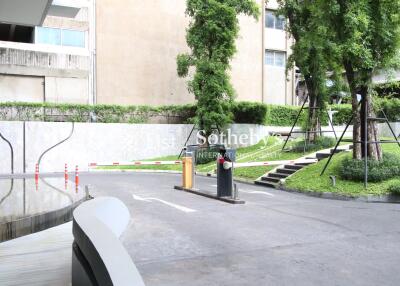 Entrance of a building with surrounding greenery