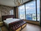 Modern bedroom with large windows and city view