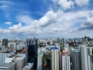 City skyline view with buildings under a blue sky