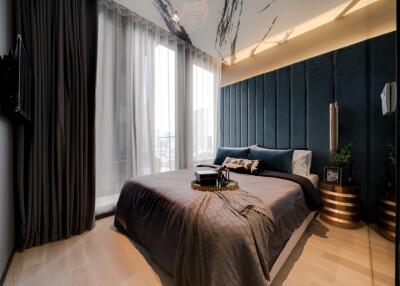 Modern bedroom with large windows and stylish decor