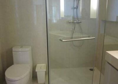 Modern bathroom with glass shower and toilet