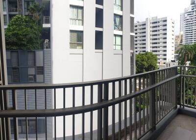 High-rise apartment balcony with view of neighboring buildings