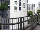 High-rise apartment balcony with view of neighboring buildings