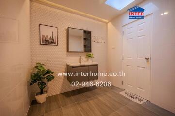 Modern bathroom with vanity and wall decorations