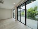 Spacious living area with large glass sliding doors to outdoor balcony