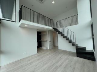 Modern duplex with staircase and loft area