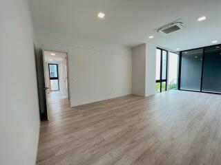 Spacious and modern living room with large windows