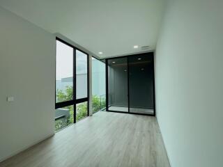 Modern living room with large windows and natural light