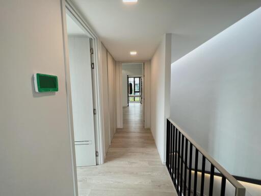 Contemporary hallway with laminate flooring