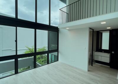 Modern double-height living area with large windows