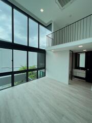 Modern double-height living area with large windows