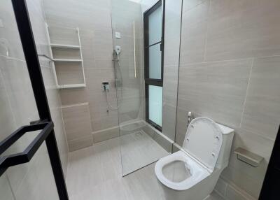 Modern bathroom with glass shower and toilet