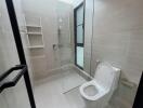 Modern bathroom with glass shower and toilet