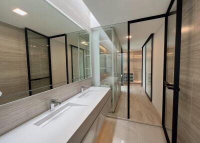 Modern bathroom with double sink and large mirrors