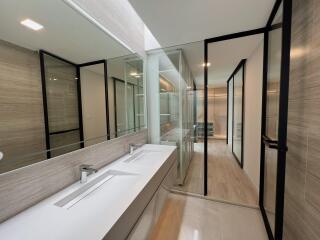 Modern bathroom with double sink and large mirrors