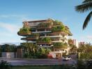 Modern apartment building with lush greenery and large balconies