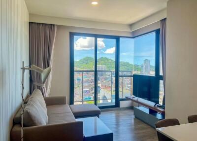 Modern living room with large window and city view