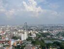 High-rise view from apartment with cityscape and cloudy sky