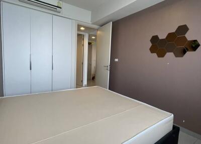 Modern bedroom with air conditioning and built-in wardrobe