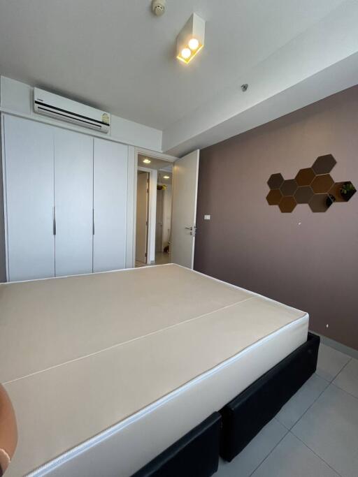 Modern bedroom with air conditioning and built-in wardrobe