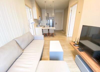 Living room with a view into the kitchen