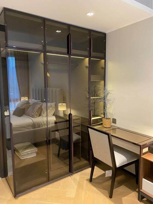 Bedroom with glass wardrobe and study desk