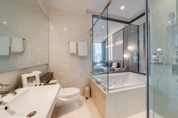 Modern bathroom with glass shower and bathtub