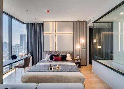 Modern bedroom with large windows and city view