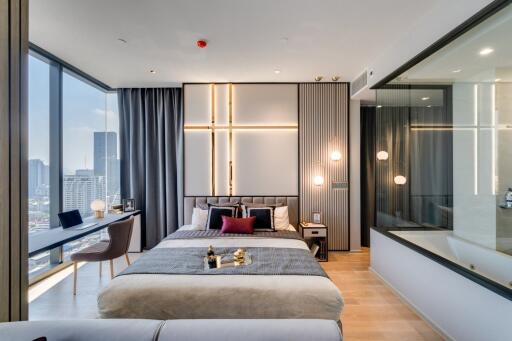 Modern bedroom with large windows and city view