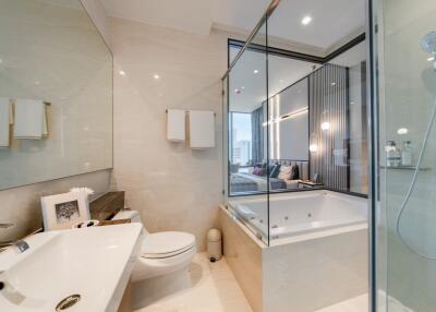 Modern bathroom with a glass-enclosed shower and bathtub