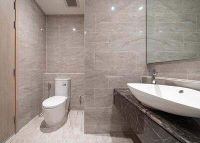 Modern bathroom with large mirror and contemporary fixtures