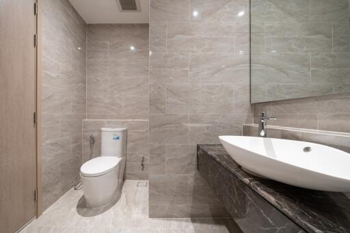 Modern bathroom with large mirror and contemporary fixtures