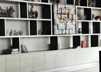 Living room with decorative shelving