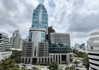 High-rise building with adjacent urban landscape