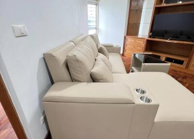 Living room with sectional sofa and entertainment center