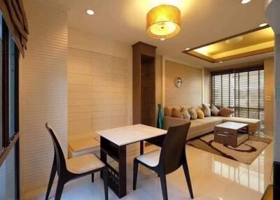 Modern living room with dining area and natural light