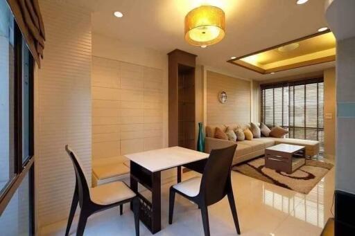 Modern living room with dining area and natural light