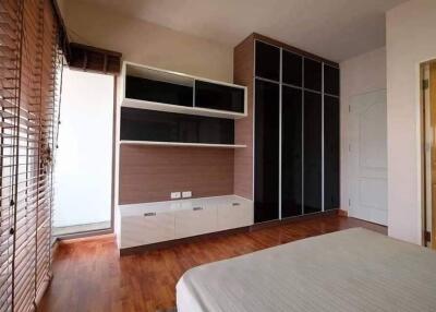 Spacious Bedroom with Built-in Wardrobe and Natural Light