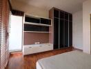 Spacious Bedroom with Built-in Wardrobe and Natural Light