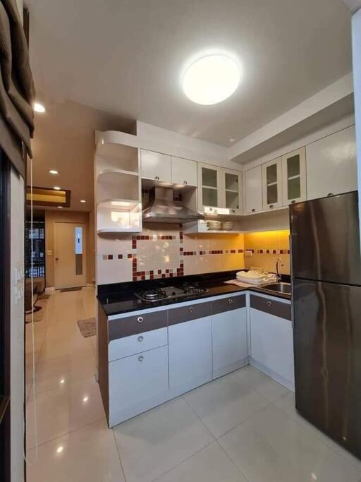 Modern kitchen with stainless steel appliances and cabinets