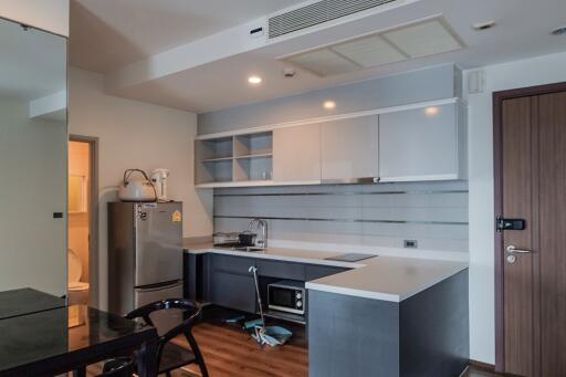 Modern kitchen with integrated appliances and stylish cabinetry