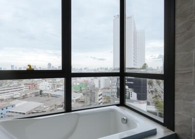 Bathroom with a view of cityscape