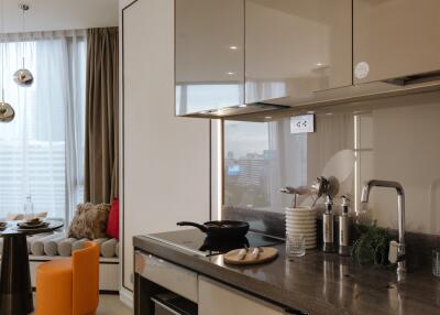 Modern kitchen area with dining space and city view