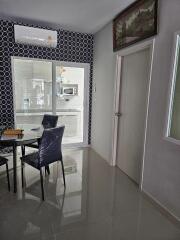 Modern dining area with a view into the kitchen