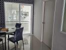 Modern dining area with a view into the kitchen